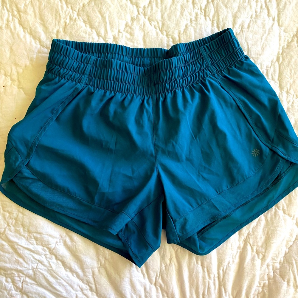 Athleta size XS teal shorts with mesh detail